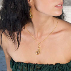 A woman wearing a gold necklace